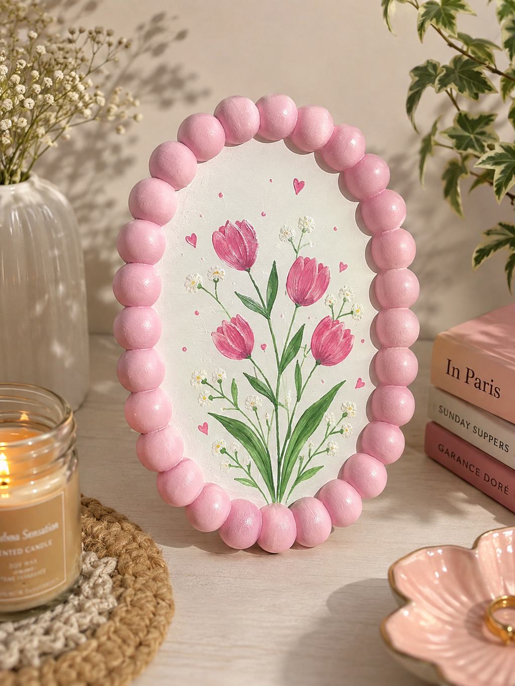 Painted pink bubble tray with tulip floral design on desk