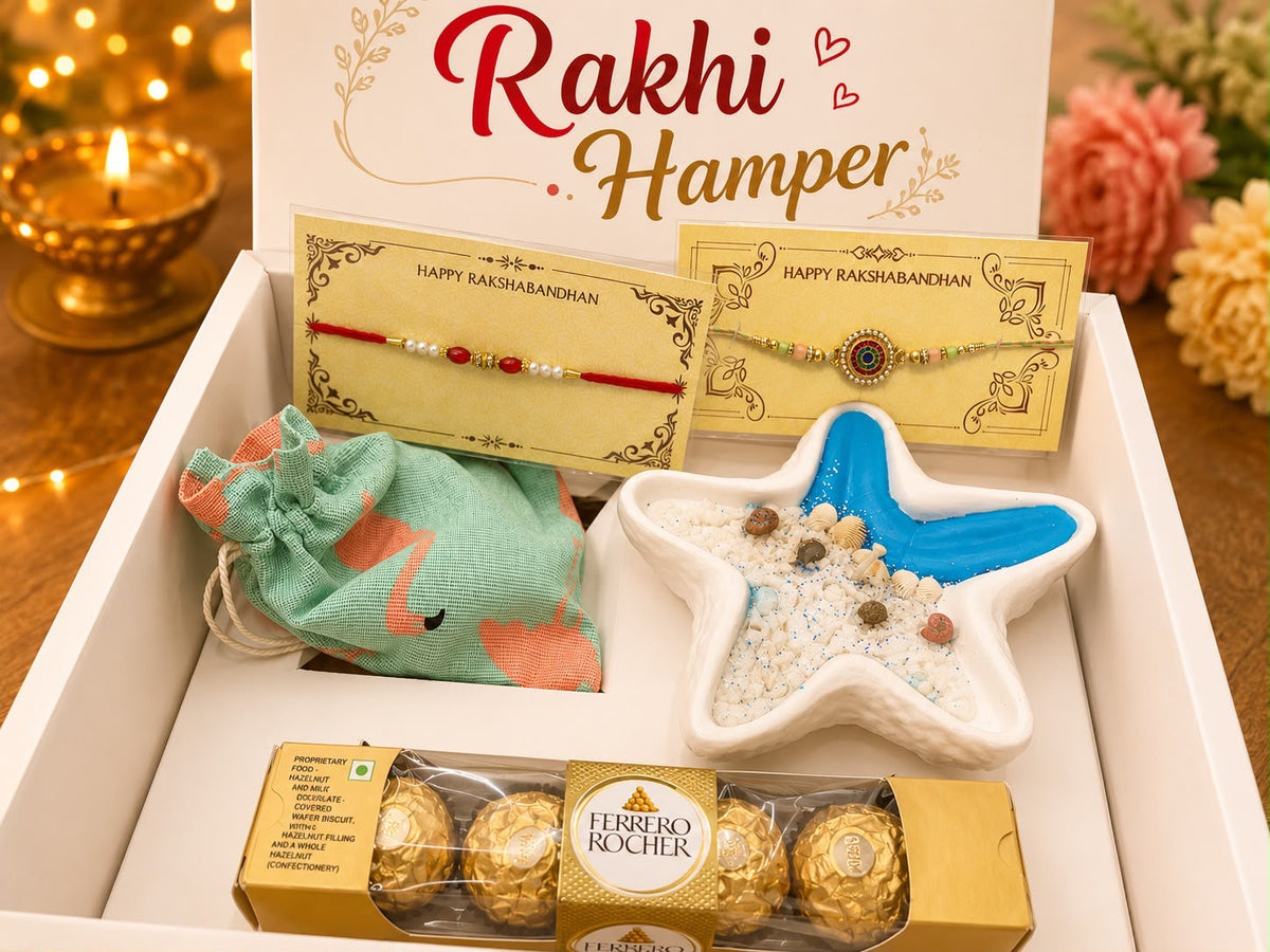 Rakhi Hamper with 2 Happy Rakshabandhan Rakhi cards, handcrafted ocean-themed star resin tray with dry fruits, green fabric dry fruit potli and Ferrero Rocher chocolates in a white branded gift box