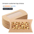 Stack of brown kraft paper pillow gift boxes with clear window filled with pistachios