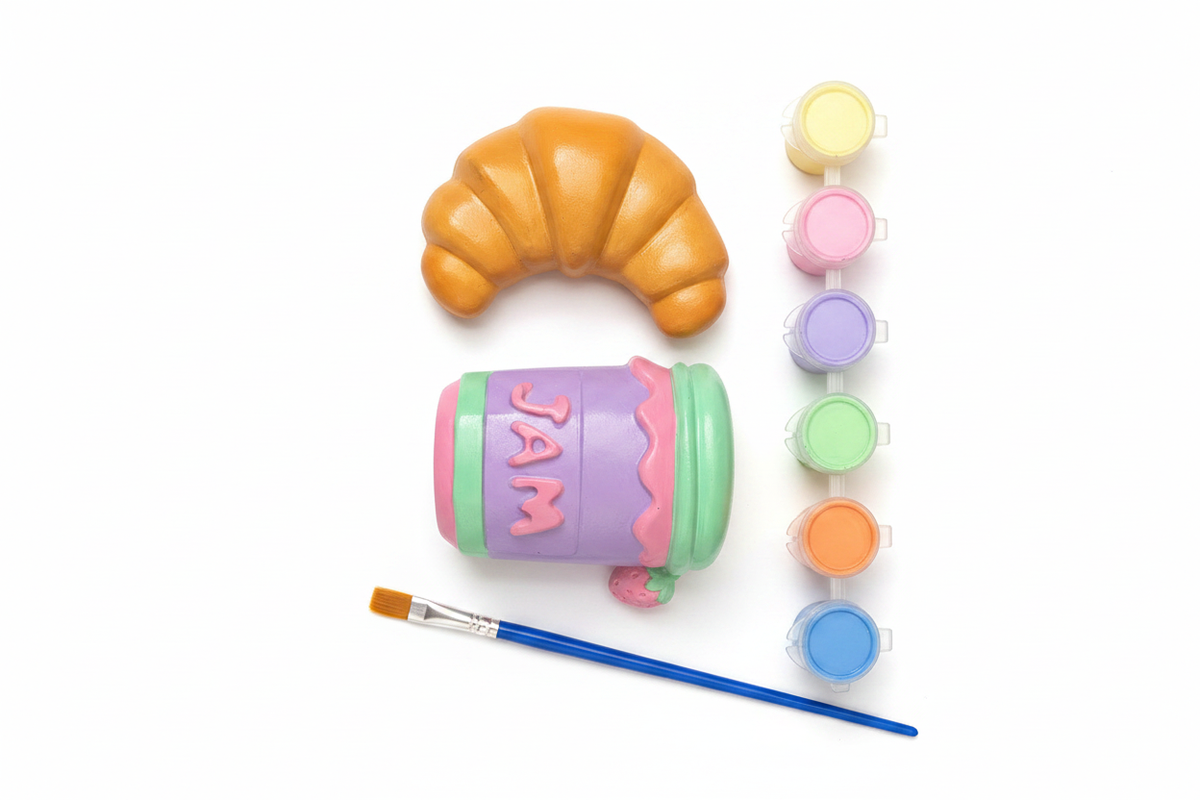 DIY Croissant and JAM Jar painted figurines flat lay with paint pots and brush