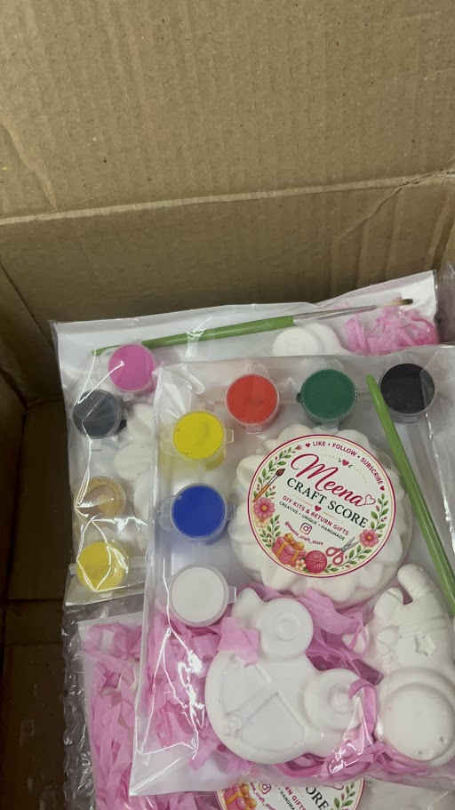 DIY plaster painting kit with 6 paint colours and pink shredded paper