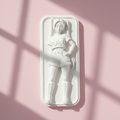 Mira plaster figure pink background editorial mockup