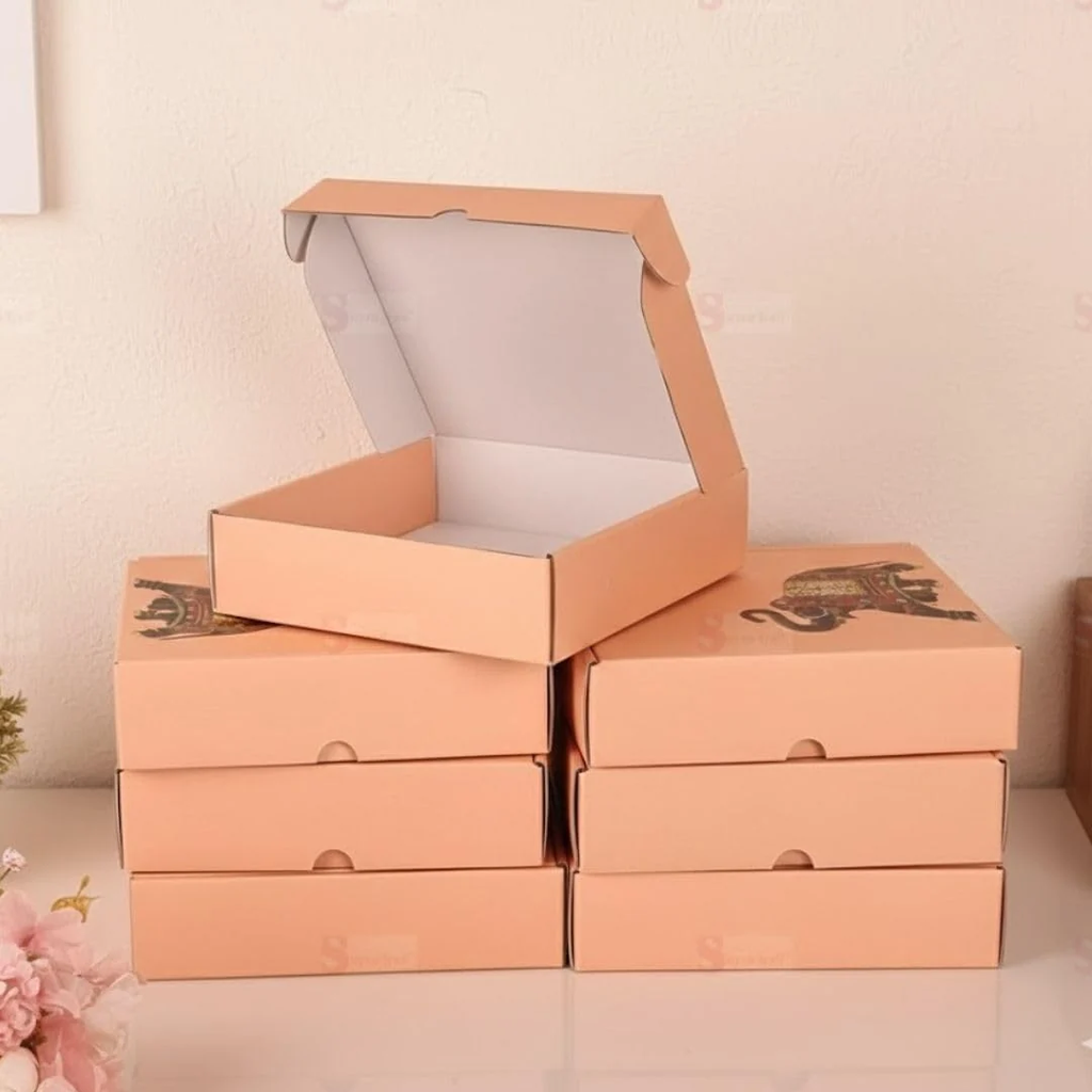 Stack of peach elephant printed corrugated gift boxes with one open
