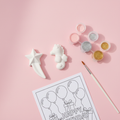Shooting star and seahorse DIY kit flat lay on pink background