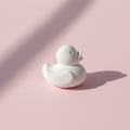Rubber duck plaster fridge magnet on pink background